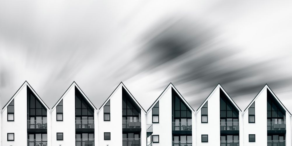 a row of white buildings sitting next to each other